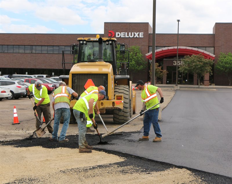 Workers working on a parking lot