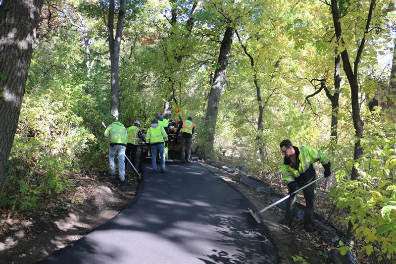 Workers working on a driveway